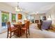Cozy living room with a fireplace and a dining area at 3652 Morning Creek Ct, Suwanee, GA 30024