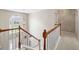 Inviting staircase with wooden banister and elegant light fixture, leading to the entrance at 3652 Morning Creek Ct, Suwanee, GA 30024