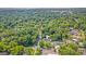 Aerial image shows the neighborhood's tree cover and proximity to local buildings at 583 Etowah Ne Dr, Marietta, GA 30060