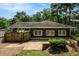 View of backyard featuring a patio and well-manicured landscaping surrounded by lush trees at 583 Etowah Ne Dr, Marietta, GA 30060
