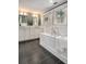 This bathroom offers a soaking tub, dual sink vanity and lots of natural light at 583 Etowah Ne Dr, Marietta, GA 30060
