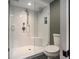 This bathroom features a frameless glass shower with subway tile and a built in bench at 583 Etowah Ne Dr, Marietta, GA 30060
