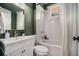 This bathroom features a vanity with gold hardware, and a shower-tub combo at 583 Etowah Ne Dr, Marietta, GA 30060