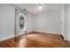 This bedroom features a large window and hardwood floors at 583 Etowah Ne Dr, Marietta, GA 30060