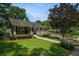 Charming home with a covered front porch, lush landscaping and an American flag creates a welcoming curb appeal at 583 Etowah Ne Dr, Marietta, GA 30060