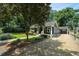 Charming single Gathering home with a well manicured lawn and beautiful trees in the front yard at 583 Etowah Ne Dr, Marietta, GA 30060