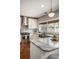 Stylish kitchen featuring stainless steel appliances, granite countertops, custom cabinets, and hardwood floors at 583 Etowah Ne Dr, Marietta, GA 30060