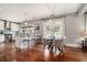 Bright kitchen with an island bar, stainless steel appliances, pendant lighting, and open layout to the dining area at 583 Etowah Ne Dr, Marietta, GA 30060