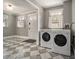 This laundry room has bright light and matching washer and dryer at 583 Etowah Ne Dr, Marietta, GA 30060