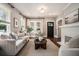 Bright and airy living room featuring a cozy sofa, modern decor, fireplace, and ample natural light at 583 Etowah Ne Dr, Marietta, GA 30060