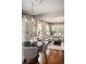 Elegant living and dining area with hardwood floors, modern lighting, comfortable seating, and ample natural light at 583 Etowah Ne Dr, Marietta, GA 30060