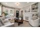Stylish living room with comfortable seating, a decorative fireplace, and modern design elements, creating a cozy atmosphere at 583 Etowah Ne Dr, Marietta, GA 30060