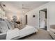This main bedroom has a ceiling fan, neutral decor, and an ensuite bathroom at 583 Etowah Ne Dr, Marietta, GA 30060
