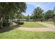 A serene image of a well-maintained park with walkways, trees, and benches, perfect for relaxation at 583 Etowah Ne Dr, Marietta, GA 30060