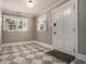 This mud room has a black and white patterned mat and bright natural light at 583 Etowah Ne Dr, Marietta, GA 30060