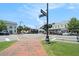 Daytime view of a quaint town square featuring stores, businesses, sidewalks and pedestrian crosswalks at 583 Etowah Ne Dr, Marietta, GA 30060