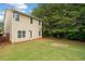 View of the home's backyard showing the two-story exterior, patio, and green lawn at 181 Ridgemont Rd, Canton, GA 30114