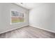 Bright dining area featuring wood floors and a modern chandelier with a window at 181 Ridgemont Rd, Canton, GA 30114