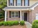 Charming two-story home with brick accents, brown shutters, and a well-maintained lawn at 181 Ridgemont Rd, Canton, GA 30114