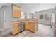 Kitchen area with stainless steel appliances, wood cabinets, breakfast bar and wood flooring at 181 Ridgemont Rd, Canton, GA 30114