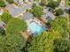 Aerial view of the community pool and ample parking surrounded by mature trees at 181 Ridgemont Rd, Canton, GA 30114