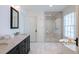 Bathroom with a double vanity, a large mirror, and a separate shower and bathtub at 204 Rumson Ne Rd, Atlanta, GA 30305