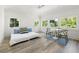 Bright bedroom with a modern ceiling fan and views from four windows at 204 Rumson Ne Rd, Atlanta, GA 30305