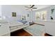 Bright bedroom with hardwood floors, ceiling fan, and large window at 204 Rumson Ne Rd, Atlanta, GA 30305