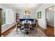 Bright dining room featuring large windows, a modern chandelier, and stylish decor at 204 Rumson Ne Rd, Atlanta, GA 30305