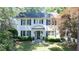 Charming two-story brick home featuring a new roof, classic blue shutters, and a welcoming entryway at 204 Rumson Ne Rd, Atlanta, GA 30305
