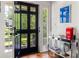 Bright foyer with a decorative console table, hardwood floors, and a glass-paneled front door at 204 Rumson Ne Rd, Atlanta, GA 30305