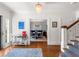 Elegant foyer with hardwood floors, a staircase, and views into the formal dining room at 204 Rumson Ne Rd, Atlanta, GA 30305