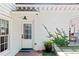 Charming entrance with a white door, brick pathway, and potted plants at 204 Rumson Ne Rd, Atlanta, GA 30305