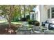 Beautifully landscaped front yard with a stone pathway leading to a cozy seating area at 204 Rumson Ne Rd, Atlanta, GA 30305