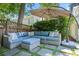 Comfortable outdoor seating area with a large sectional and shade umbrella at 204 Rumson Ne Rd, Atlanta, GA 30305