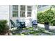 Inviting outdoor seating area with stylish chairs and stone pavers, perfect for relaxing at 204 Rumson Ne Rd, Atlanta, GA 30305