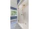 The bathroom features a glass-enclosed shower with gold hardware and subway tile surround at 204 Rumson Ne Rd, Atlanta, GA 30305