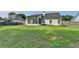 Expansive backyard view features a screened porch, privacy fence and verdant lawn at 2790 Meadow Gate Way, Loganville, GA 30052