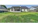 The wide backyard features a screened in porch and a privacy fence at 2790 Meadow Gate Way, Loganville, GA 30052