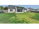 A large, well manicured backyard features a screened in porch and a wooden fence at 2790 Meadow Gate Way, Loganville, GA 30052
