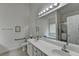 Bright bathroom featuring double sinks, a large mirror, and separate tub and shower at 2790 Meadow Gate Way, Loganville, GA 30052