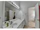 Bright bathroom with double sinks, a large mirror and access to the main bedroom at 2790 Meadow Gate Way, Loganville, GA 30052