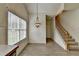 Bright breakfast nook with wood-look flooring, staircase, and window at 2790 Meadow Gate Way, Loganville, GA 30052