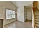 Dining area with tile flooring, a chandelier, and stairs leading to the upper level at 2790 Meadow Gate Way, Loganville, GA 30052