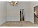 Dining room with wainscoting, neutral carpet, and convenient access to kitchen at 2790 Meadow Gate Way, Loganville, GA 30052