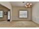 Bright dining room featuring neutral carpet, wainscoting, and ample natural light at 2790 Meadow Gate Way, Loganville, GA 30052