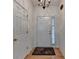 Bright entryway featuring hardwood floors, neutral walls, a decorative rug, and an elegant chandelier at 2790 Meadow Gate Way, Loganville, GA 30052