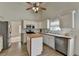 Bright kitchen with stainless appliances, a butcher block island, and white cabinets at 2790 Meadow Gate Way, Loganville, GA 30052
