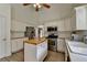 Bright kitchen featuring stainless appliances, butcher block island, and white cabinetry at 2790 Meadow Gate Way, Loganville, GA 30052
