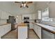 Bright kitchen with stainless appliances, butcher block island, and tile floor at 2790 Meadow Gate Way, Loganville, GA 30052
